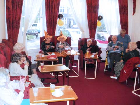 residents enjoying a group activity of entertainment and singing as they chose to